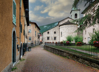 Fiumalbo (Modena, Italy), road leading to the main square and view of the apse of the church of San...