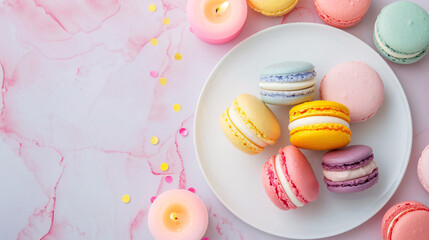 Obraz premium Colorful Macarons on White Plate with Soft Pink Background
