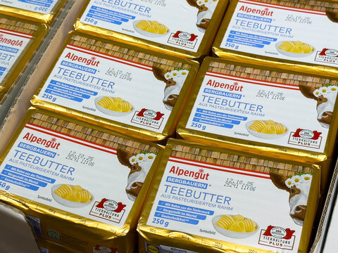 Villach, Austria - August 03, 2025: Alpengut Teebutter packaging displayed in a grocery store, showcasing the product's quality and branding for culinary enthusiasts and home cooks