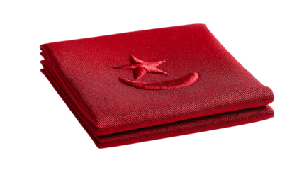 Folded flag with embroidered star and crescent fabric detail isolated on transparent background 