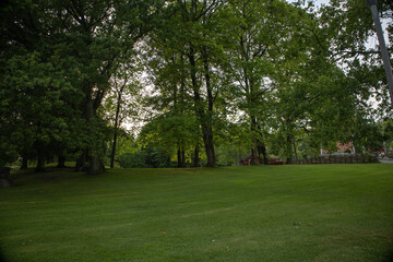 Scenic view of Orebro parks next to the flowing creek surrounded by natural greenery in central...