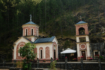 Orthodox church Bele Vode and bell tower in Mokra Gora, Serbia, surrounded by nature and forest...
