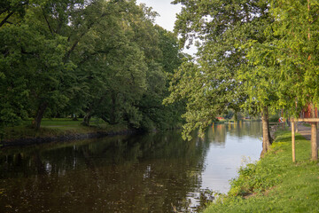 Scenic view of Orebro parks next to the flowing creek surrounded by natural greenery in central...