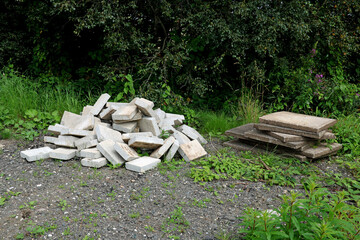 Old Concrete Blocks and Paving Slabs Piled at a Rural Farmyard Location