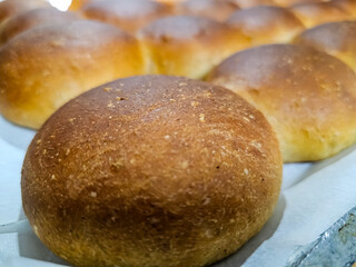 Fresh Bread Rolls on Tray Close-Up