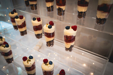 A beautifully arranged candy bar featuring an assortment of colorful sweets, chocolates, and...