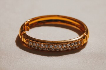 Gold bangle with clear stones