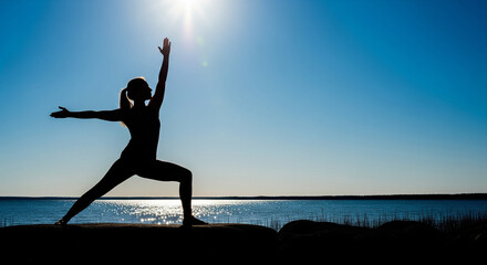 Fototapeta premium Zenith Serenity: Women, Men, and the Concept of Healthy Exercise Above the World