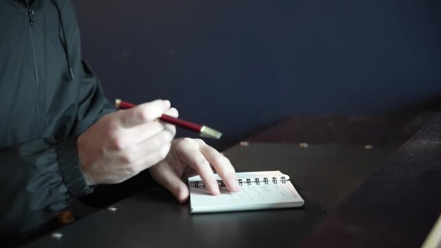 Hands Writing in Notebook &ndash; Close-Up of Manual Notes and Planning