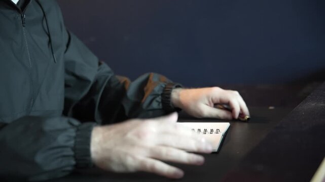 Hands Writing in Notebook &ndash; Close-Up of Manual Notes and Planning