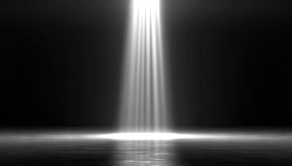 Centralized spotlight illuminating a dark space.