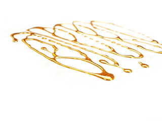 Gold streaks on white background. Gold drops