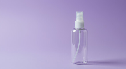 Elegant clear spray bottle with white pump nozzle on a soft lavender background, perfect for beauty, skincare, or cleaning product mockups and branding.