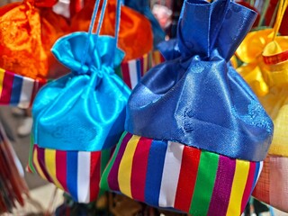 Traditional Korean handmade lucky bags made from satin in various colors - Koreans give a fortune...