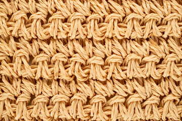 Woven straw mat, macro, top view.