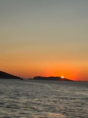 Golden Hour View with Islands and Boat