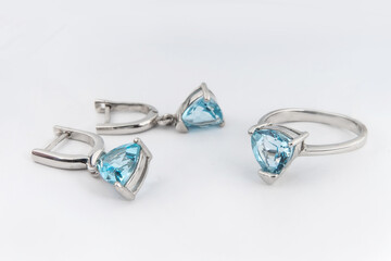 Elegant jewelry set of white gold ring, necklace and earrings with diamonds. Silver jewellery set...