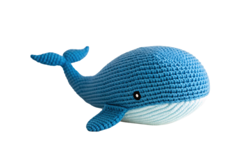 Blue crocheted whale with white striped belly and raised tail fin, isolated on a transparent background