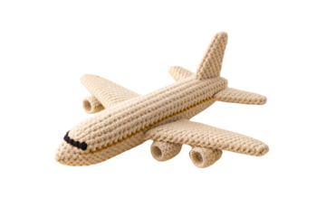 Cream colored crocheted airplane toy with yellow stripe detail and black nose markings, isolated on a transparent background