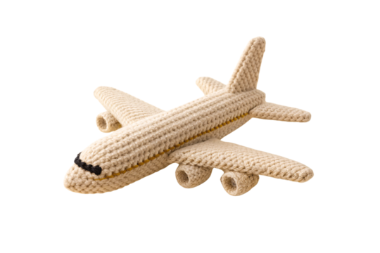 Cream colored crocheted airplane toy with yellow stripe detail and black nose markings, isolated on a transparent background