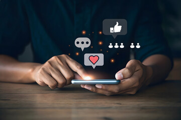 Person using smartphone with social media icons like heart and chat bubbles technology communication