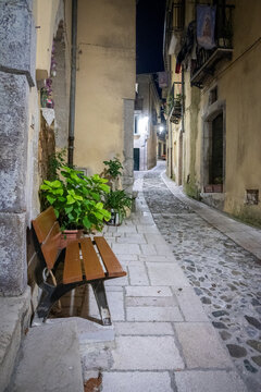 Fototapeta night streets of the old village. bench in the foreground