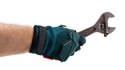 Hand with adjustable wrench at work