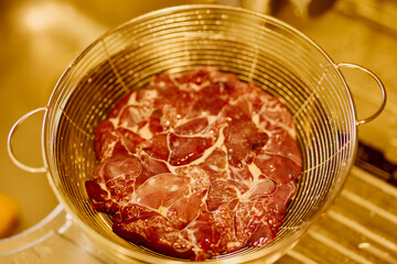chicken livers in a colander to drain the milk they were kept in