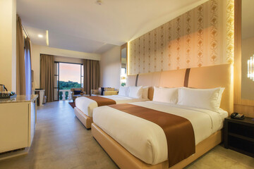 bedroom with two queen-sized beds, contemporary decor