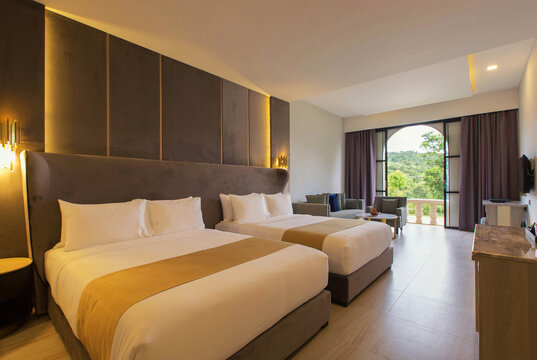 bedroom with two queen-sized beds, contemporary decor