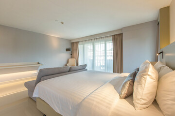 bedroom with two queen-sized beds, contemporary decor.