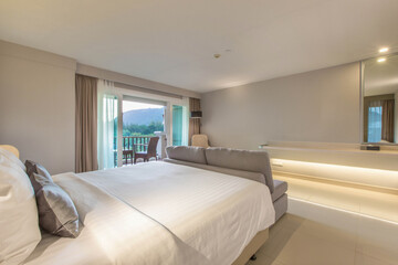bedroom with two queen-sized beds, contemporary decor.