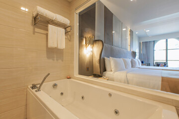 Bathroom featuring mosaic wall tiles.