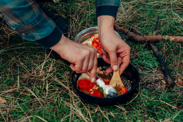 woman hands holding red rose petals