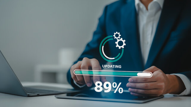 Man in blue suit touching tablet screen with updating progress bar and 89 percent business