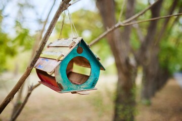 A bird house in the park.