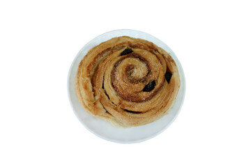Delicious Spiral Pastry with Raisins Served on a White Ceramic Plate