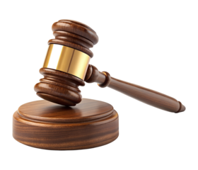 A classic wooden gavel with a golden band is poised on its round block. This isolated transparent png object represents legal authority and order.