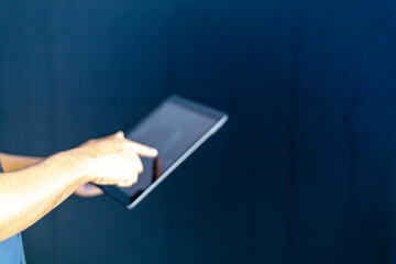  a man in a blue shirt extending his other hand with the palm. This versatile gesture can represent...