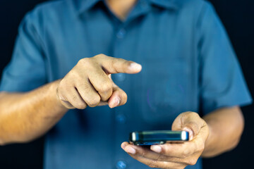  a man in a blue shirt extending his other hand with the palm. This versatile gesture can represent...