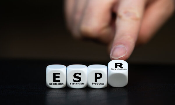 Photo of dice spelling &ldquo;ESPR &ndash; Ecodesign for Sustainable Products Regulation&rdquo; with a finger pointing. Symbolizes EU sustainability law, eco-design, and circular economy goals.