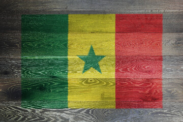 Fototapeta premium Senegal flag on rustic old wood surface background