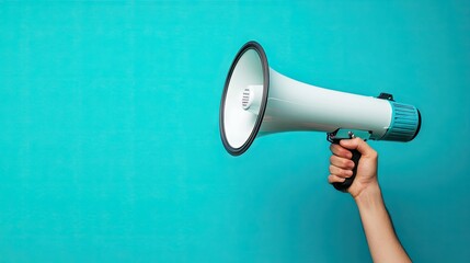 Hand holding a megaphone with motion blur effect on a bright cyan background, emphasizing energy, urgency, and spreading the word