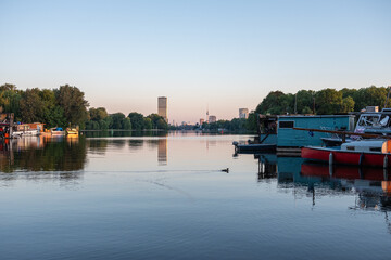 Boats and houseboat anchoring on rummelsburg lake in Berlin, Germany