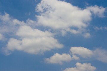 Obraz premium The white clouds in the blue sky.
