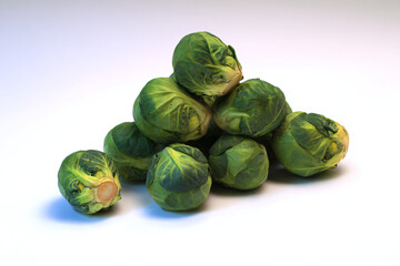 a pile of brussels sprouts on a white surface