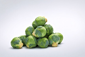 Fototapeta premium a pile of brussels sprouts on a white surface