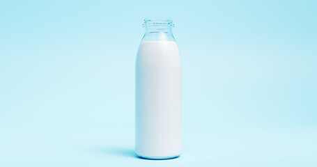 Clear Glass Bottle Filled With Milk on Blue Background