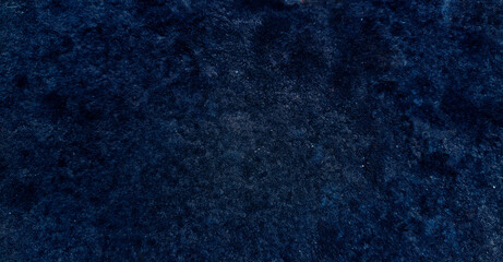 Dark rough cement wall background for graphic design or wallpaper.