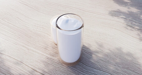 Glass Cup of Foamy Milk Coffee on Wooden Surface